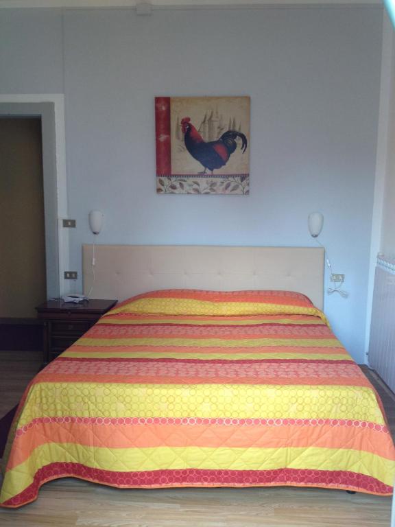 Postel nebo postele na pokoji v ubytování Hotel Domodossola