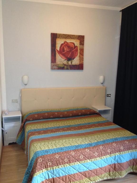 Postel nebo postele na pokoji v ubytování Hotel Domodossola