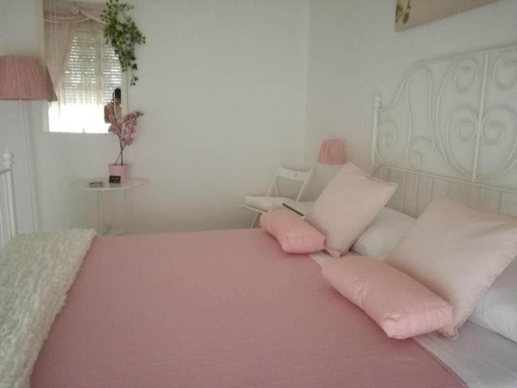 A bed or beds in a room at La Casa di Isabella Loreto