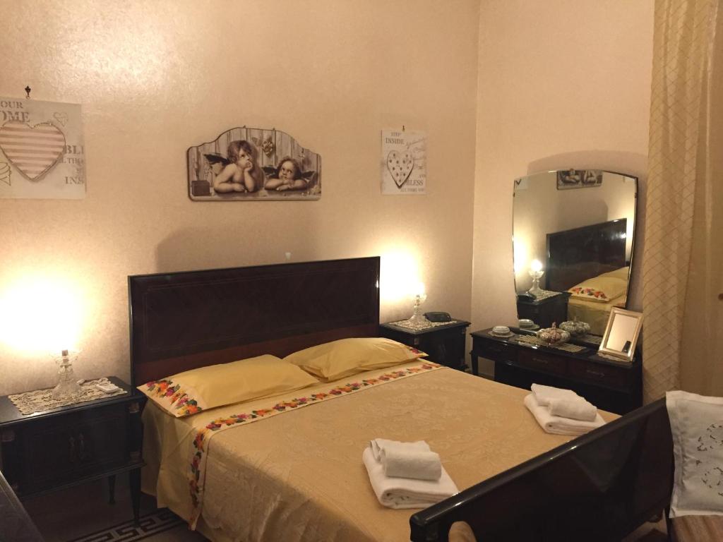 מיטה או מיטות בחדר ב-Al.Fa