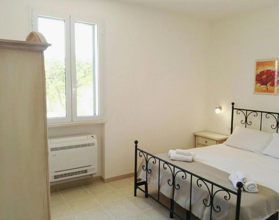 Postel nebo postele na pokoji v ubytování Agriturismo Capani