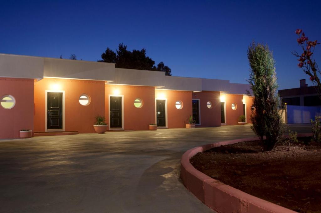 a building with lights on the side of it at Ribeirotel in Albergaria-a-Velha