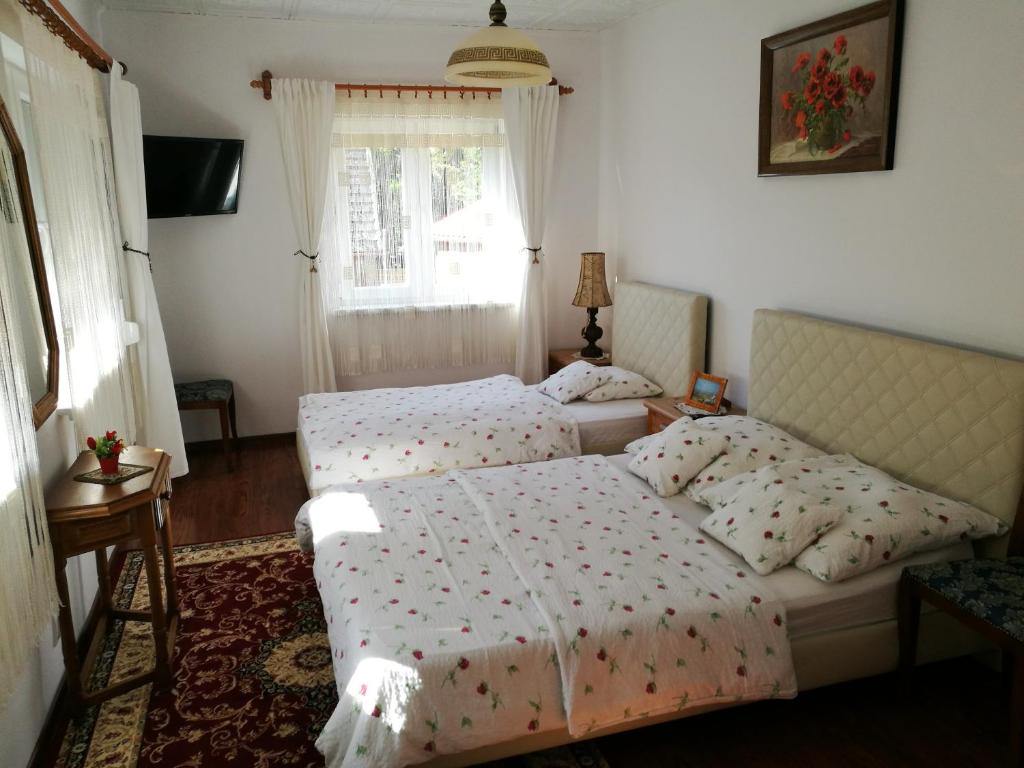 Ένα ή περισσότερα κρεβάτια σε δωμάτιο στο Gościniec Grek Zorba - pokoje i domki 4 osobowe - 16km od Zator Energylandia