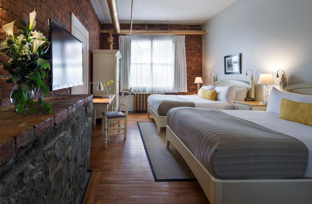 Postel nebo postele na pokoji v ubytování Auberge Saint-Pierre