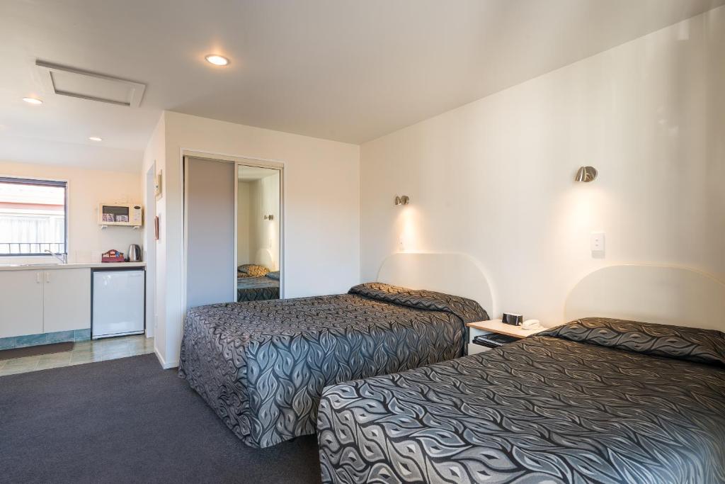Postel nebo postele na pokoji v ubytování Annabelle Court Motel