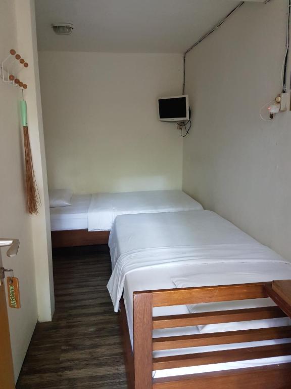 Postel nebo postele na pokoji v ubytování Peye Guesthouse