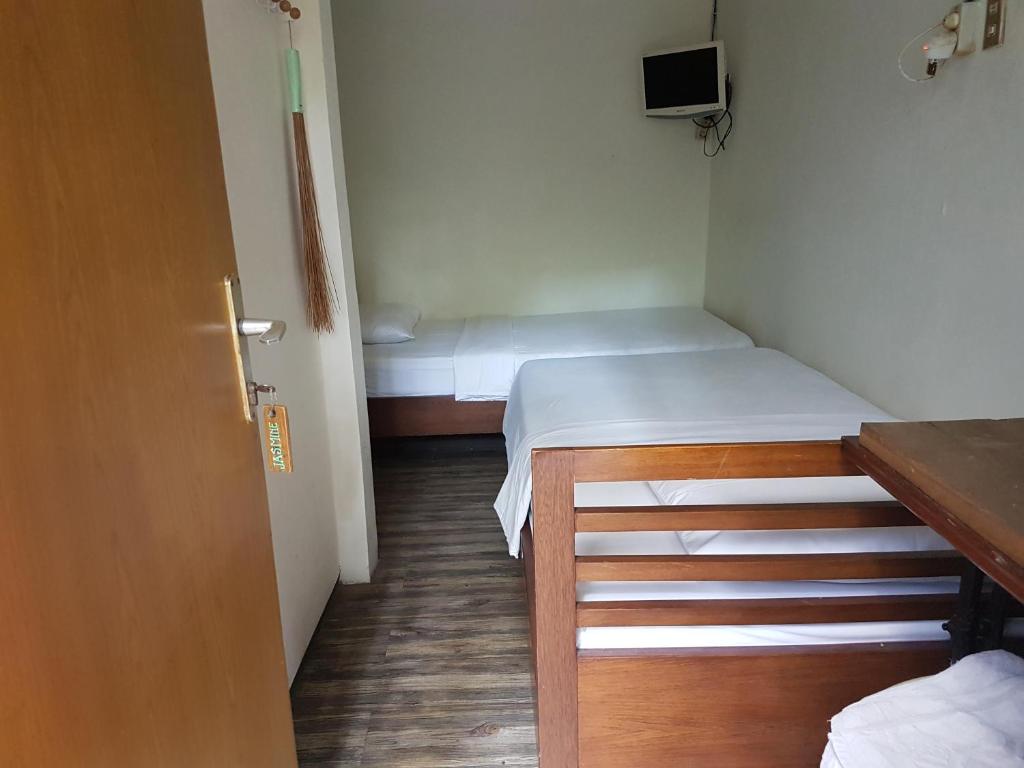 Postel nebo postele na pokoji v ubytování Peye Guesthouse