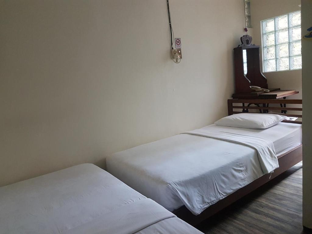 Postel nebo postele na pokoji v ubytování Peye Guesthouse