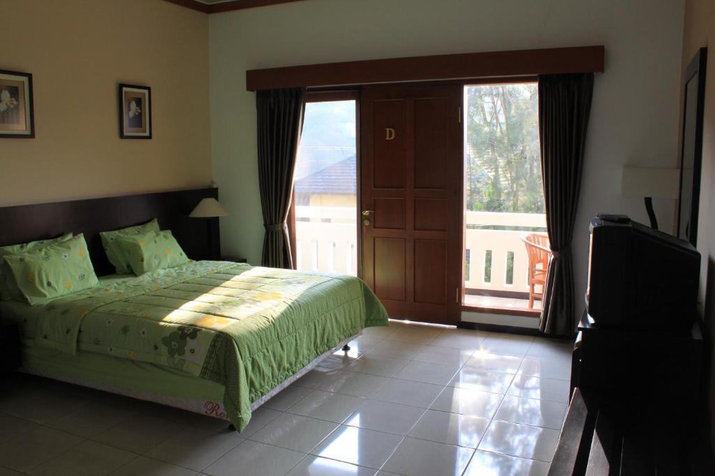 Tempat tidur dalam kamar di De Hill Villa