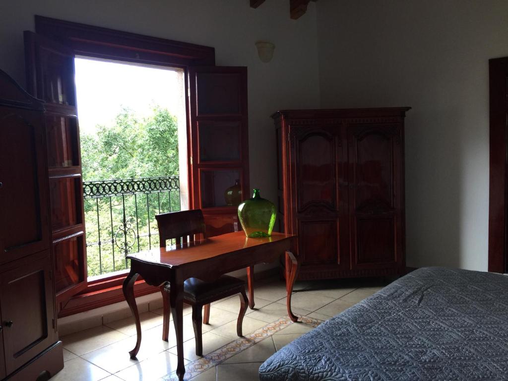 Postel nebo postele na pokoji v ubytování Hotel Mansion Real