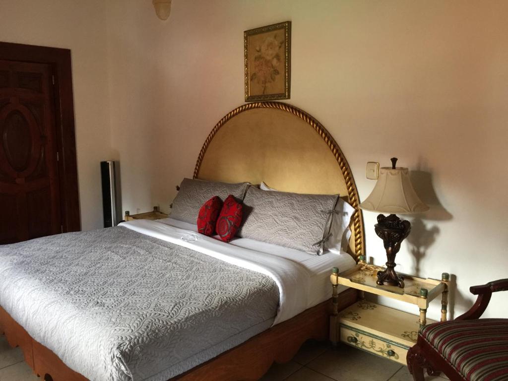 Postel nebo postele na pokoji v ubytování Hotel Mansion Real