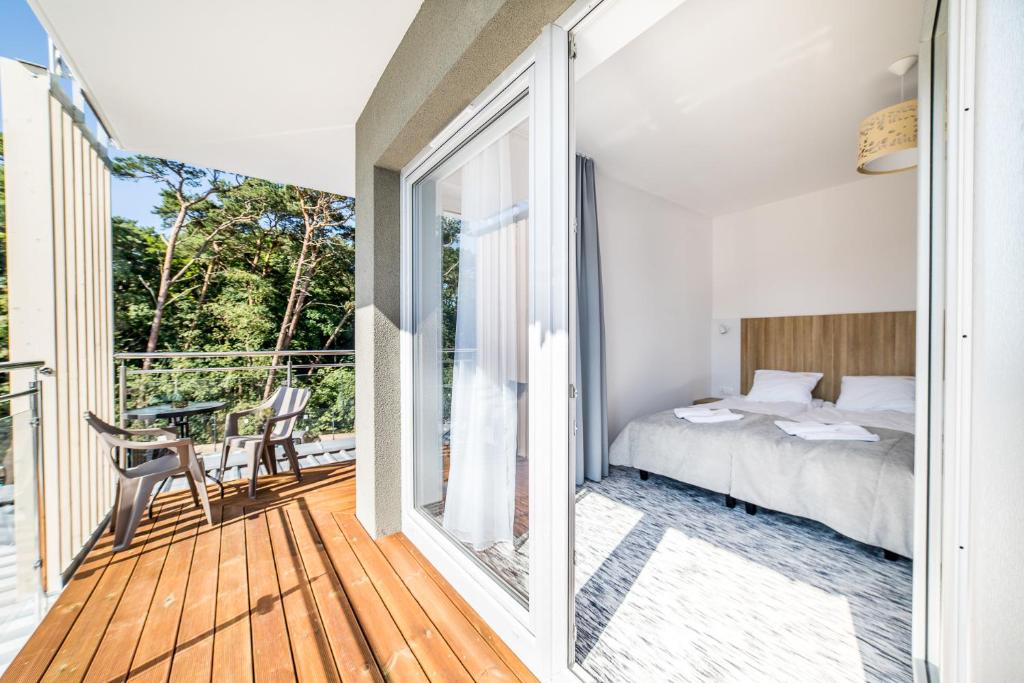 Postel nebo postele na pokoji v ubytování WYDMA Resort Medi & SPA - Normobaria