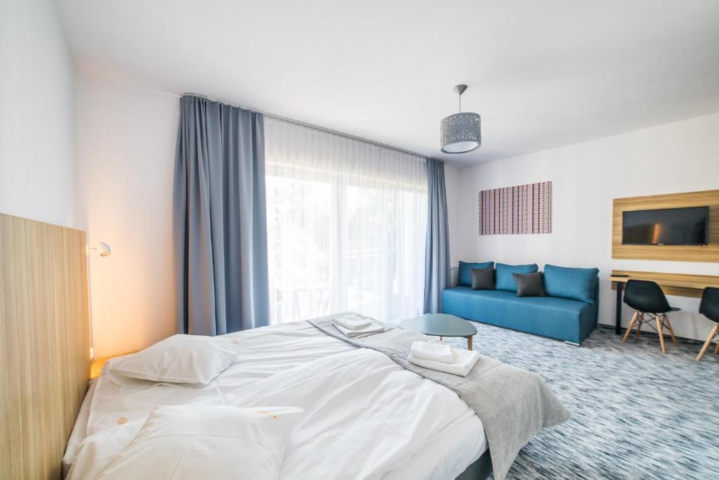 Postel nebo postele na pokoji v ubytování WYDMA Resort Medi & SPA - Normobaria