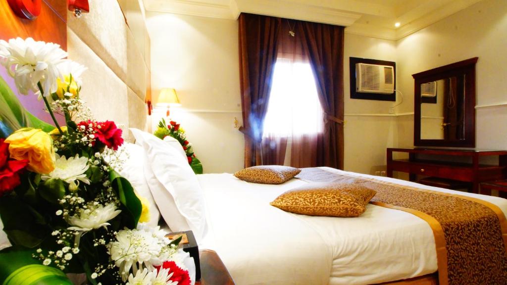 Ein Bett oder Betten in einem Zimmer der Unterkunft almuhaidb apartment jeddah