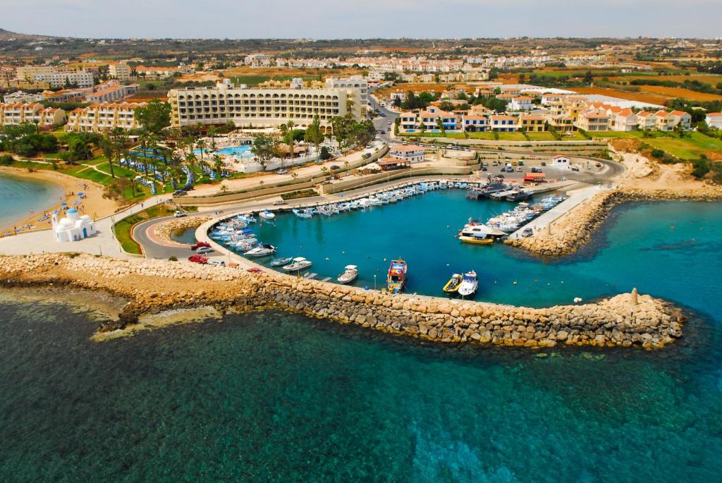 an aerial view of a harbor with boats in the water at Apartment nearby Golden Coast in Protaras