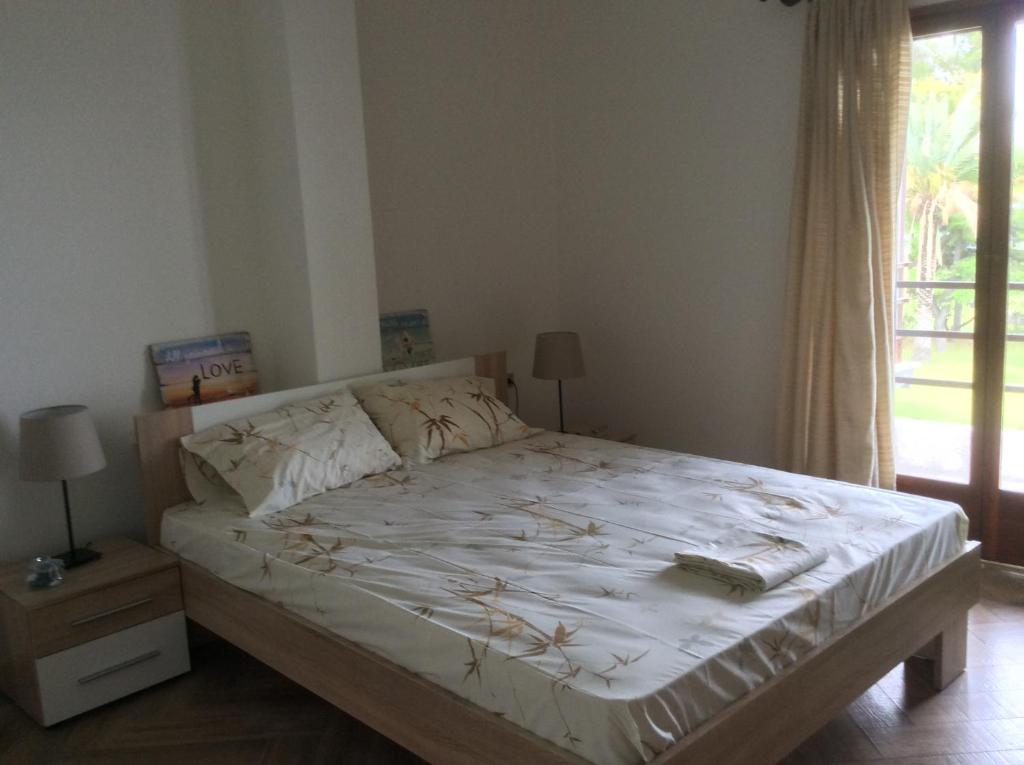 Postel nebo postele na pokoji v ubytování Villa Kalandra