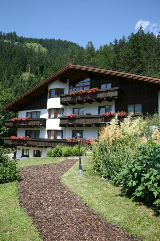 a building with flowers on the balconies of it at Haus Montana in Elbigenalp