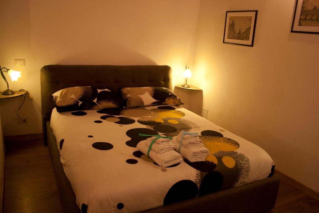 A bed or beds in a room at Le Scalette