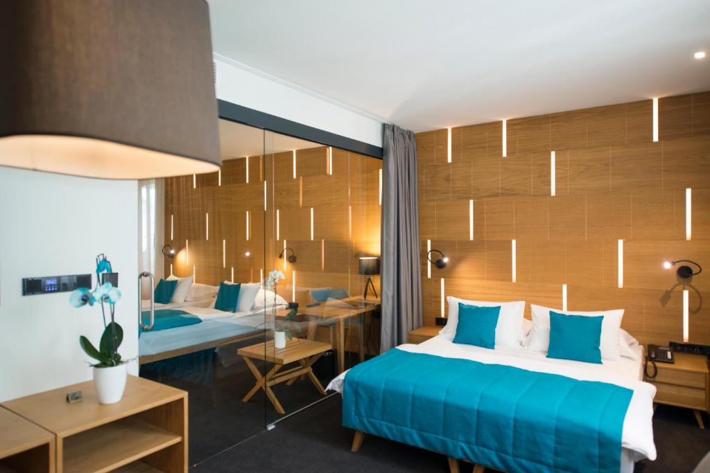 Postel nebo postele na pokoji v ubytování Hotel Sana