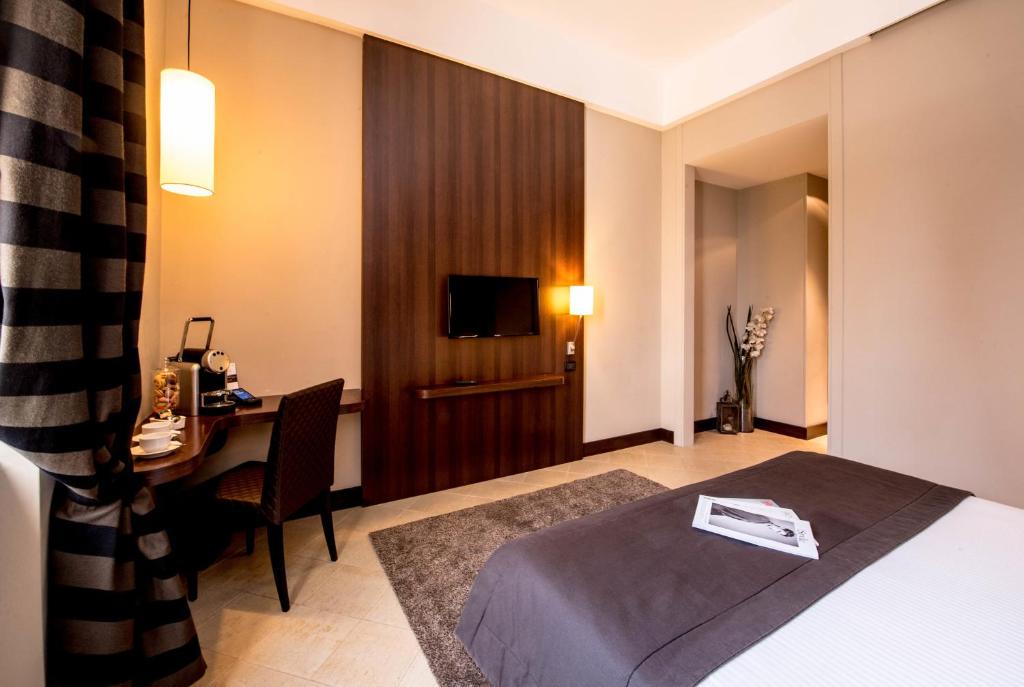 Postel nebo postele na pokoji v ubytování TH Roma - Carpegna Palace
