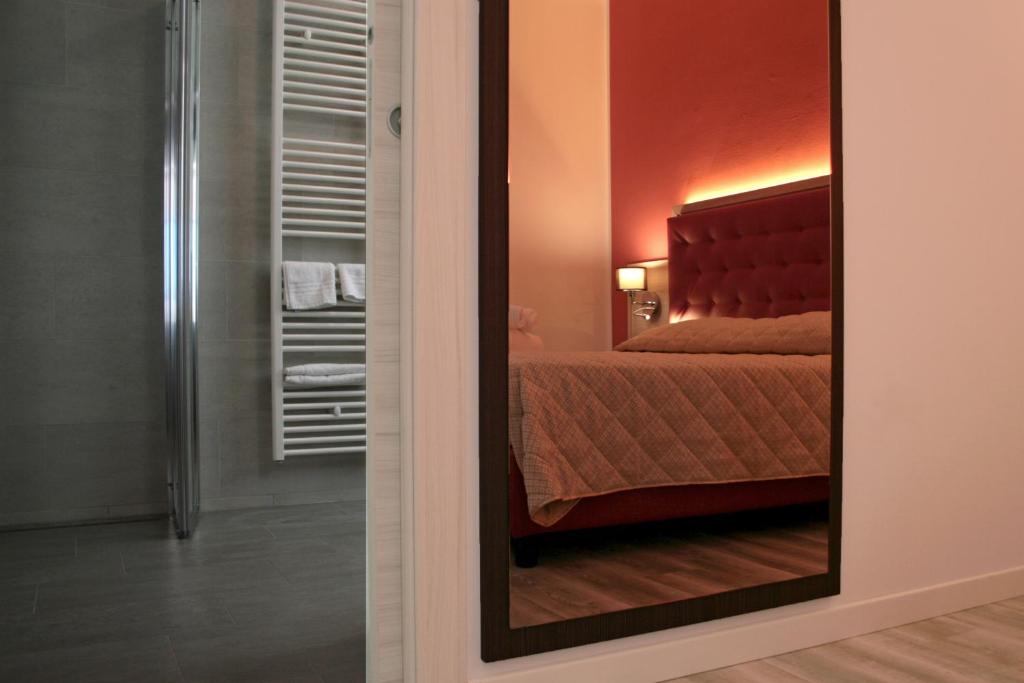 Postel nebo postele na pokoji v ubytování Alma Living Hotel- Al Girarrosto