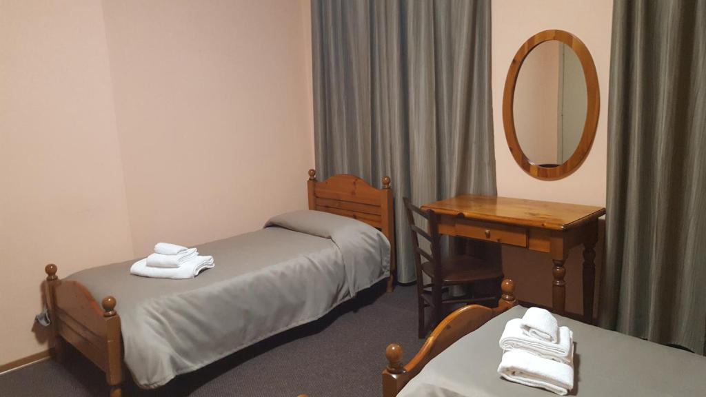 Postel nebo postele na pokoji v ubytování Hotel Calaluna