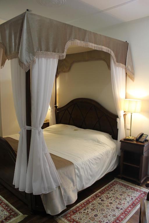 Postel nebo postele na pokoji v ubytování Hotel Ibn-Arrik