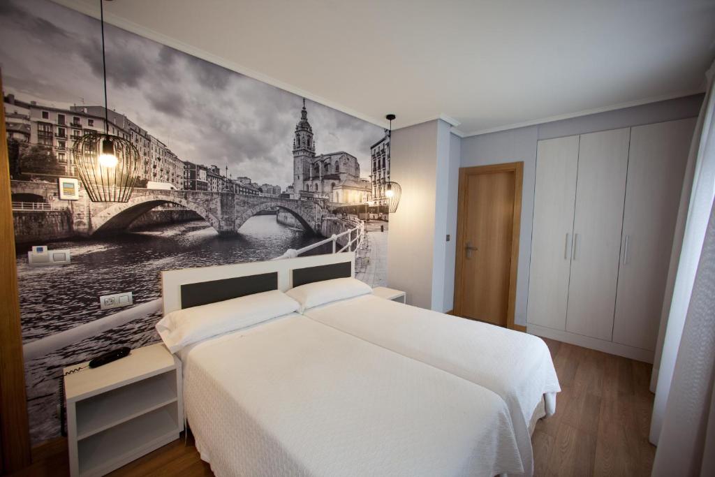Postel nebo postele na pokoji v ubytování Hotel Sirimiri