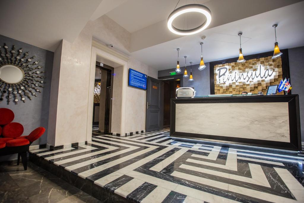 TV a/nebo společenská místnost v ubytování Peninsula Boutique Hotel