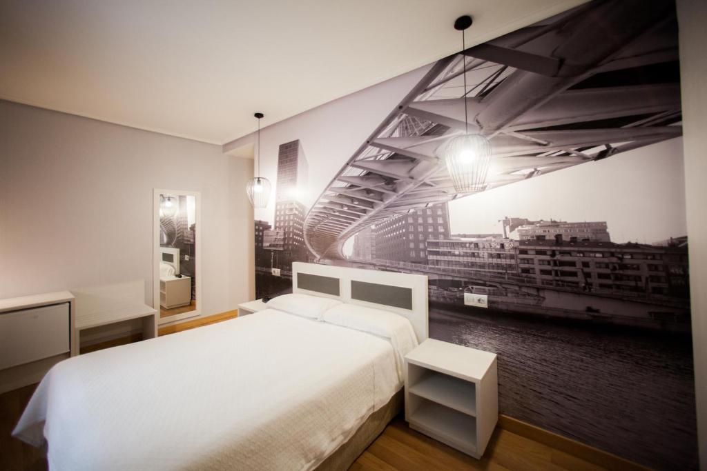 Postel nebo postele na pokoji v ubytování Hotel Sirimiri