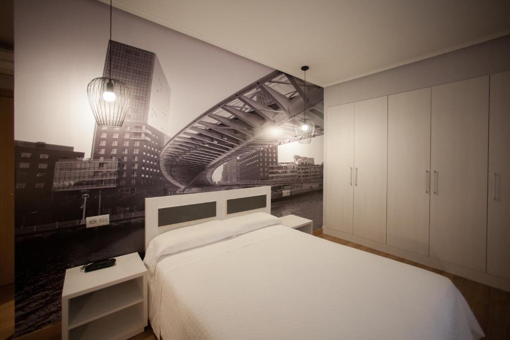 Postel nebo postele na pokoji v ubytování Hotel Sirimiri