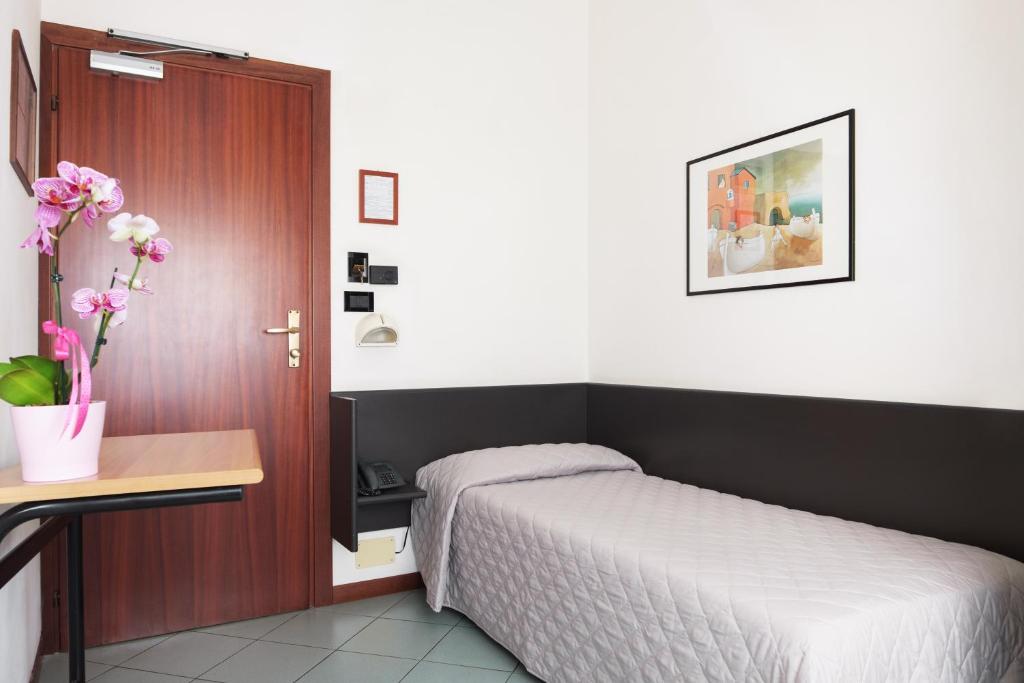 Postel nebo postele na pokoji v ubytování Hotel St Pierre