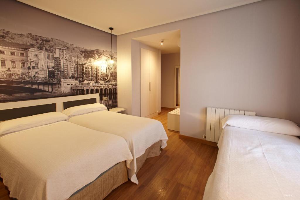 Postel nebo postele na pokoji v ubytování Hotel Sirimiri
