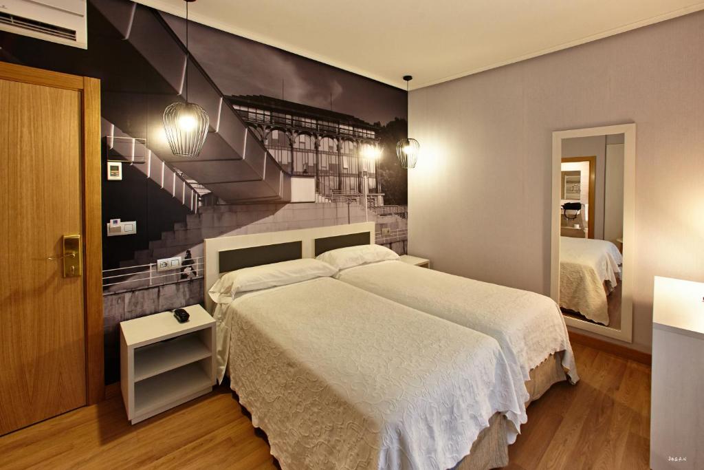 Postel nebo postele na pokoji v ubytování Hotel Sirimiri