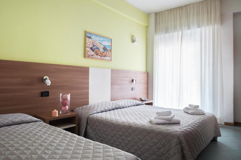 Postel nebo postele na pokoji v ubytování Hotel St Pierre