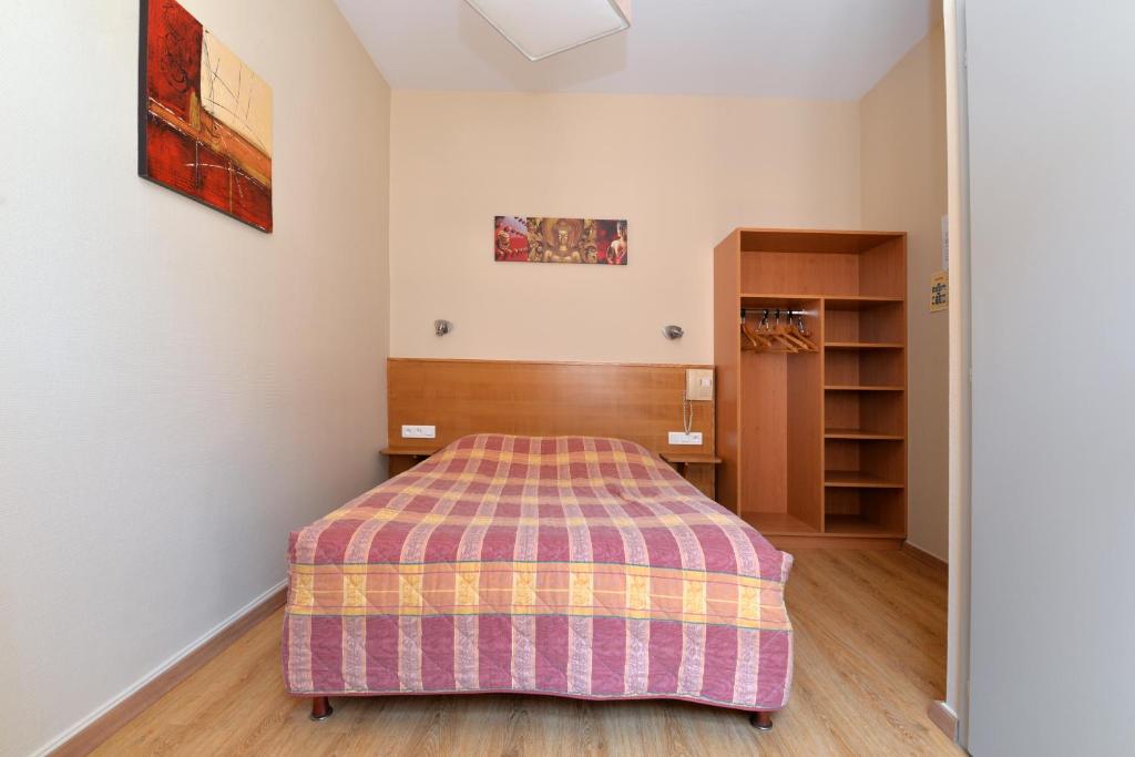 Postel nebo postele na pokoji v ubytování Hotel Restaurant Dontenville