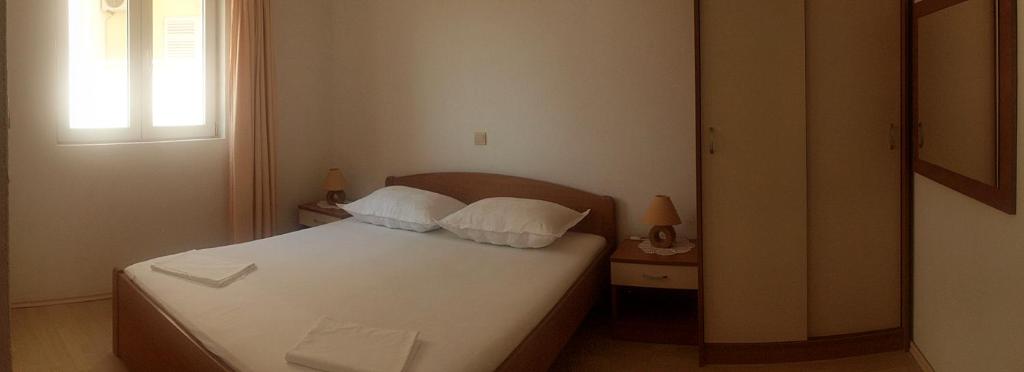 Postel nebo postele na pokoji v ubytování Apartments Mesec
