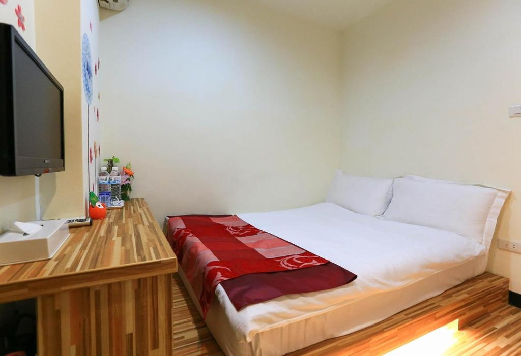Postel nebo postele na pokoji v ubytování Mei Lodge