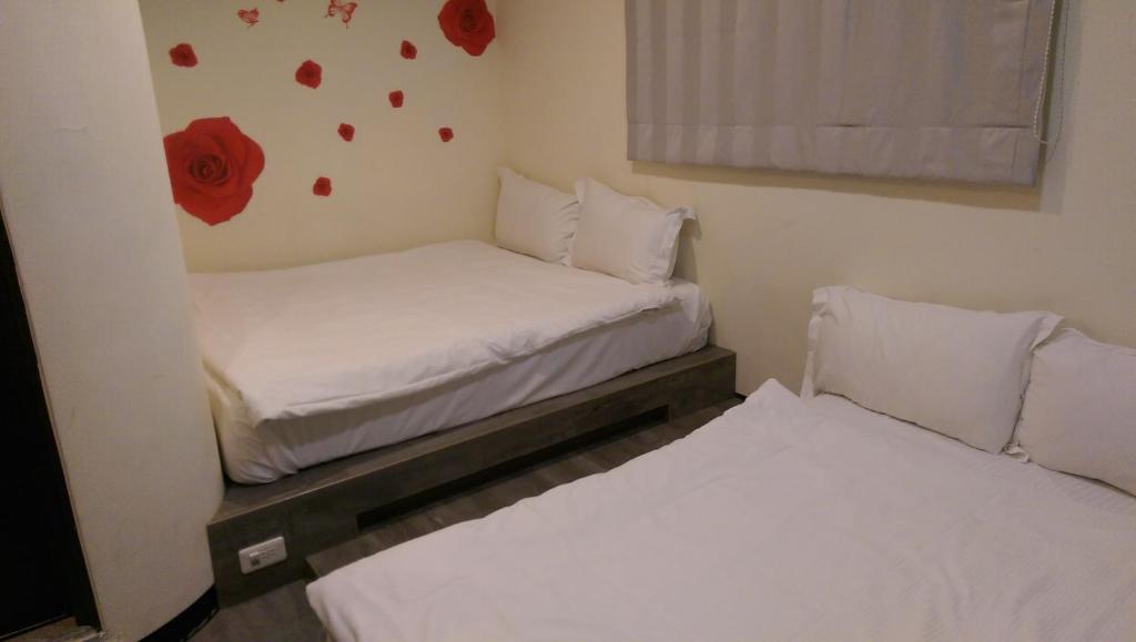 Postel nebo postele na pokoji v ubytování Mei Lodge