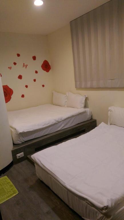 Postel nebo postele na pokoji v ubytování Mei Lodge