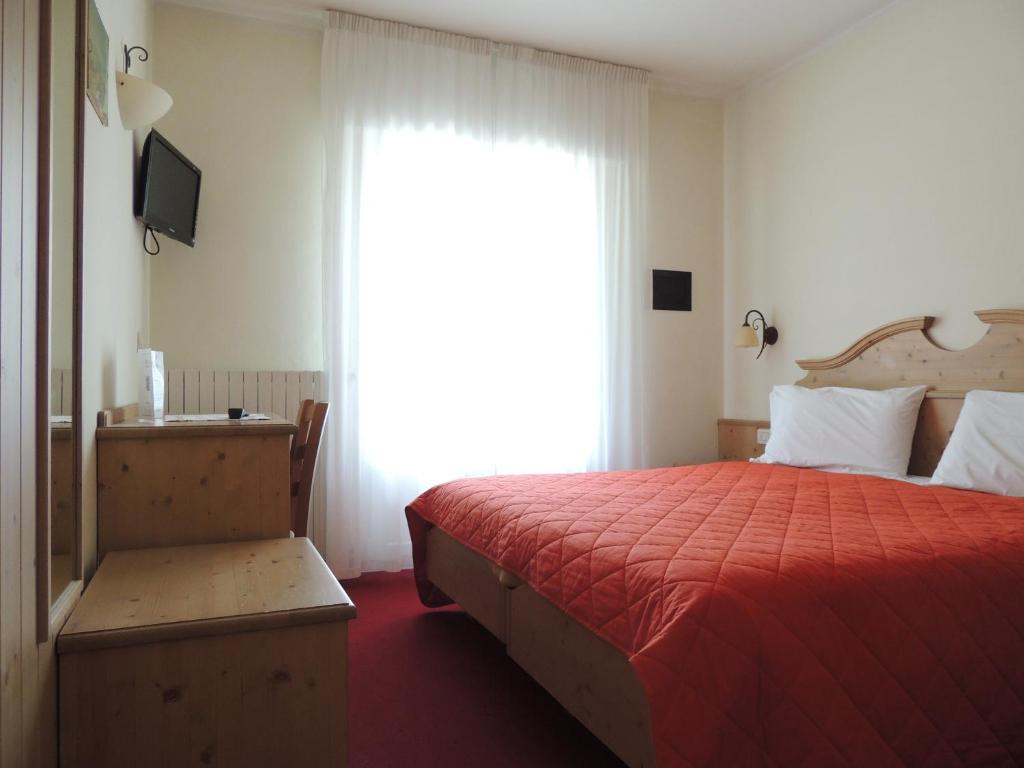 Postel nebo postele na pokoji v ubytování Liz Hotel & Apartments