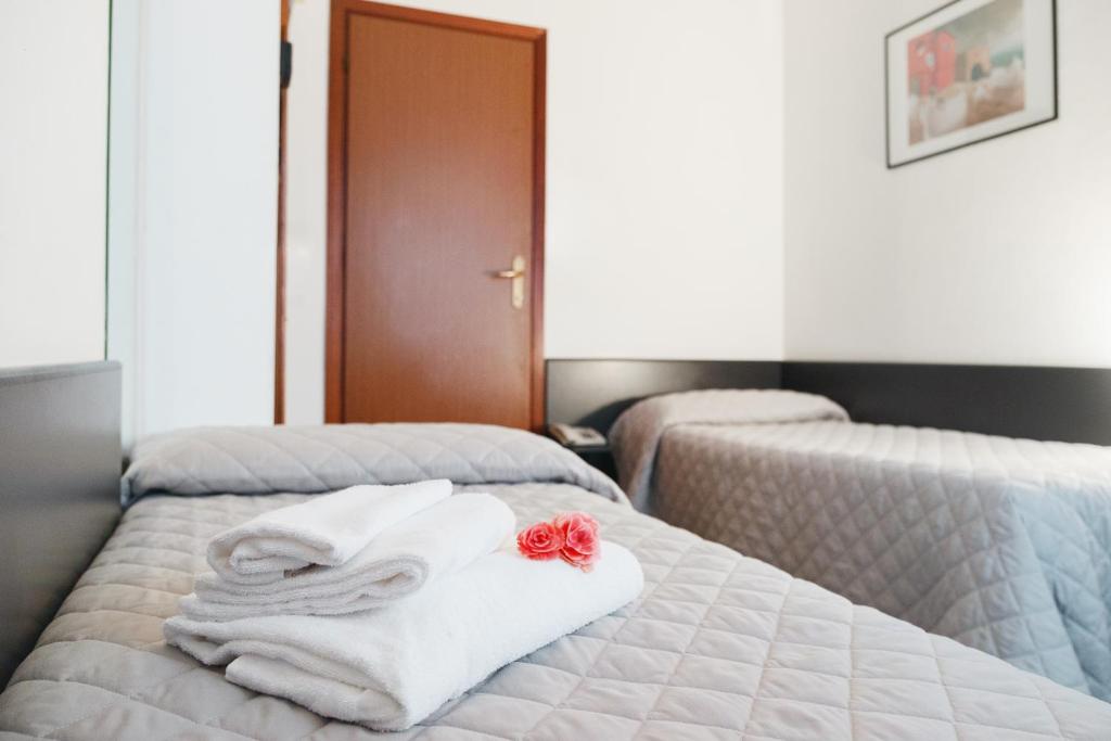 Postel nebo postele na pokoji v ubytování Hotel St Pierre