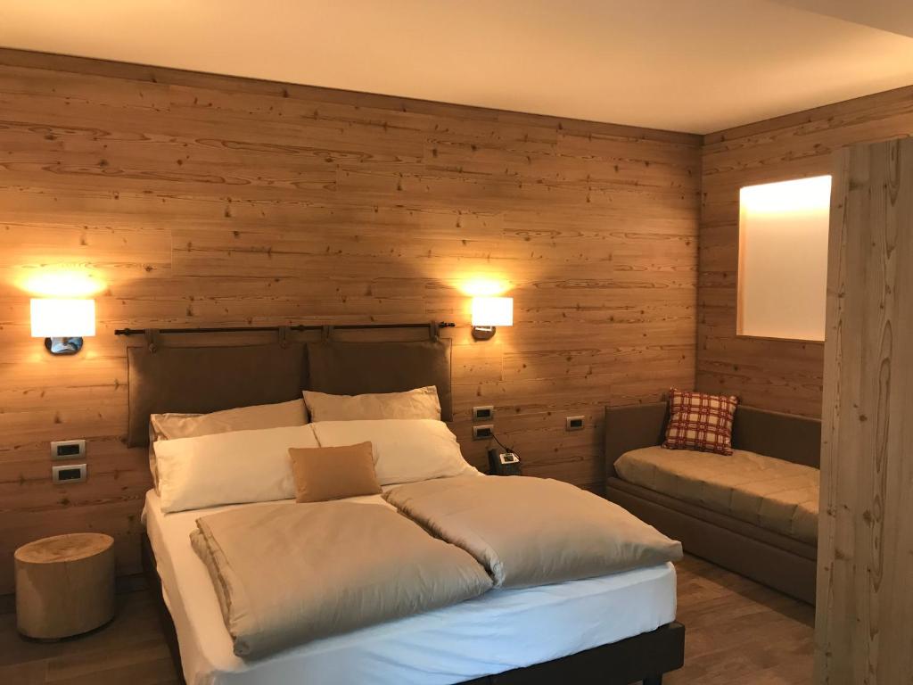 Postel nebo postele na pokoji v ubytování Hotel Le Cime