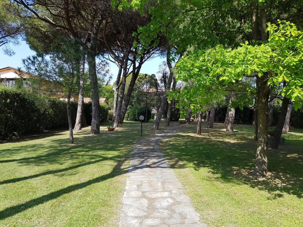 a path in a park with trees and grass at Appartamento e Parco Sergiunca in Ameglia
