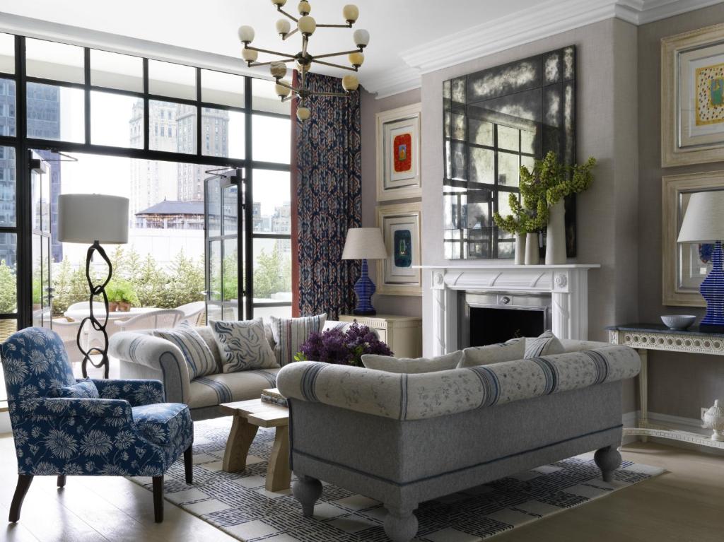 a living room with a couch and a fireplace at The Whitby Hotel in New York