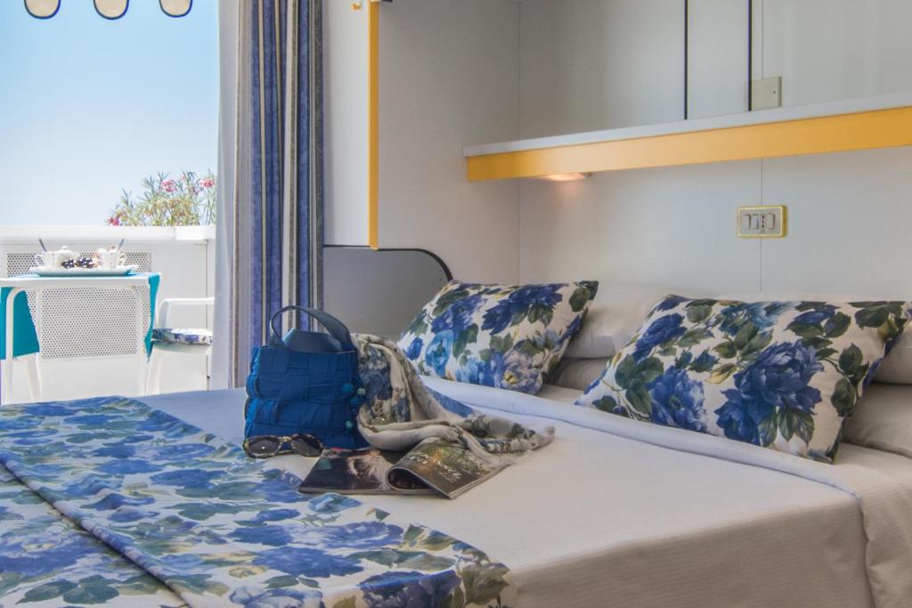 Postel nebo postele na pokoji v ubytování Hotel Doriana