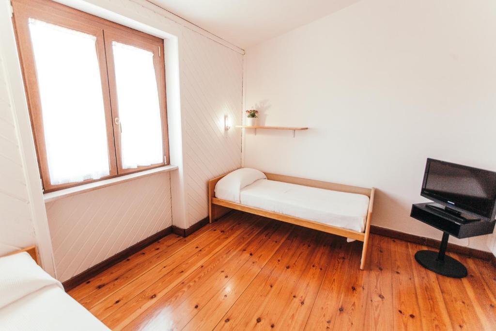 Łóżko lub łóżka w pokoju w obiekcie Domus Leonardo-Private Free Parking