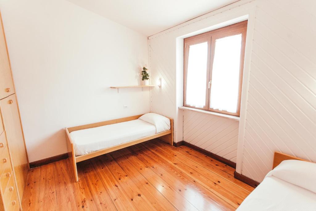 Łóżko lub łóżka w pokoju w obiekcie Domus Leonardo-Private Free Parking