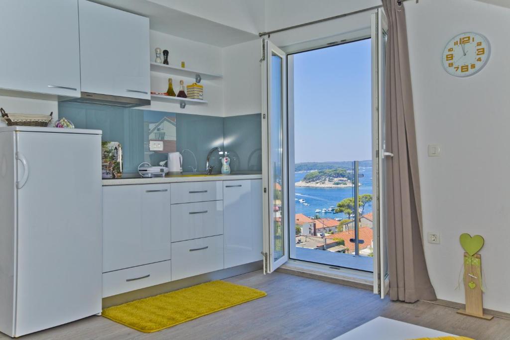 Kuchyň nebo kuchyňský kout v ubytování Apartments Juric
