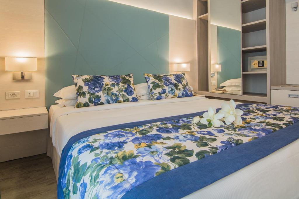 Postel nebo postele na pokoji v ubytování Hotel Doriana